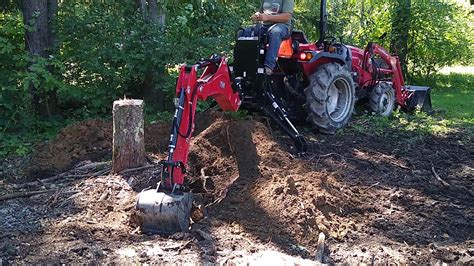 diggingup stump with a skid steer attachments backhoe|How to Remove a Tree Stump with a Backhoe .